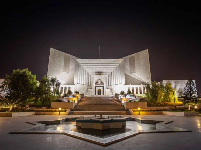 The Supreme Court of Pakistan building illuminated at night in Islamabad