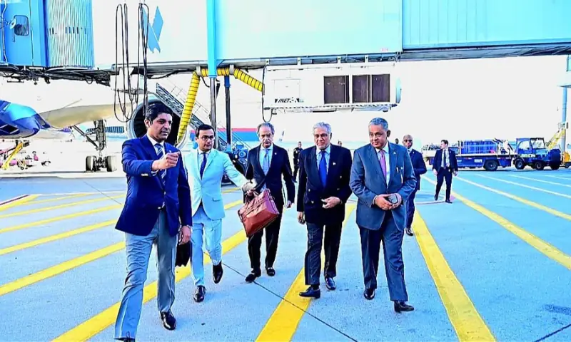 Prime Minister Shehbaz Sharif and officials walk across an airport apron during a previous UN General Assembly journey