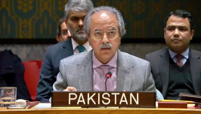Pakistan's UN Ambassador Asim Iftikhar Ahmad speaks from behind the Pakistan nameplate at the United Nations