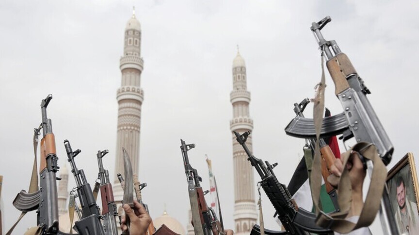 Houthi supporters raise rifles during a rally in Sanaa, Yemen