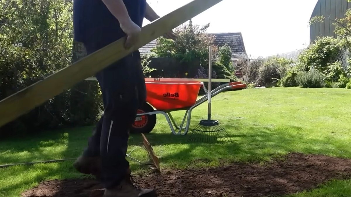Homeowners Smooth Yard with Simple Wood Plank Technique - yard leveling