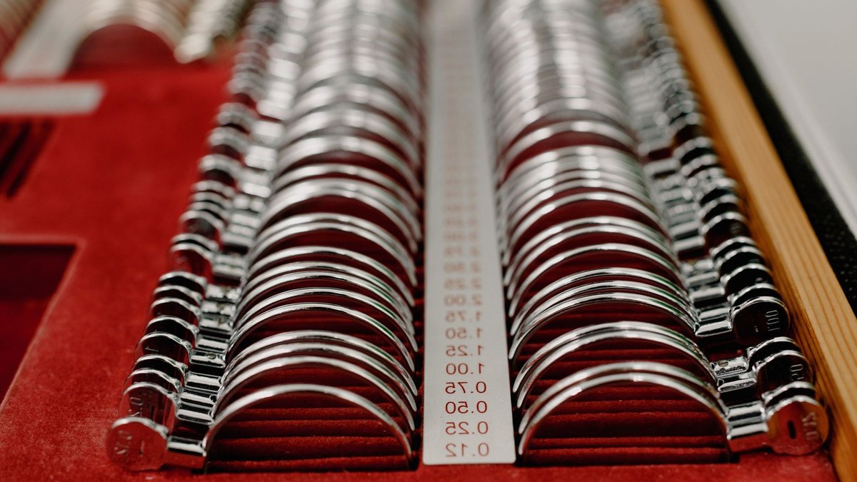 Halloween contact lenses get spooky makeover From above of arranged rows of trial spectacle lenses for examining visual impairments in clinic.