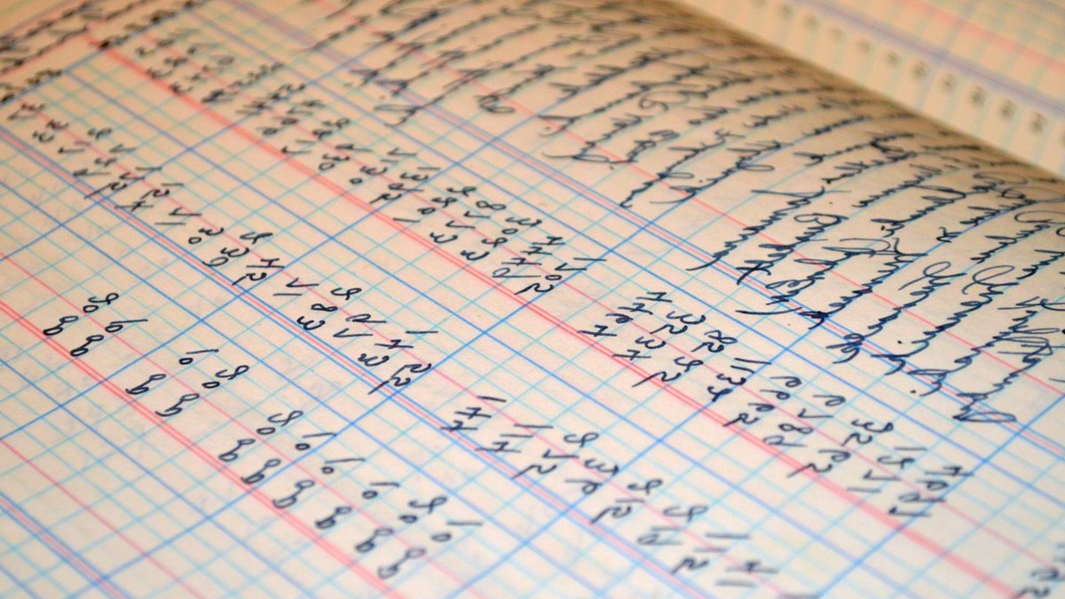 Ledger reassures users after third-party data breach Close-up of a vintage handwritten ledger detailing financial records and accounts.