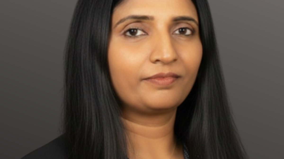 Radhika Vyasam CITP Headshot with dark grey background.