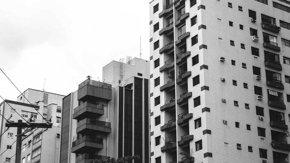 Monochrome view of residential buildings in a modern urban cityscape.