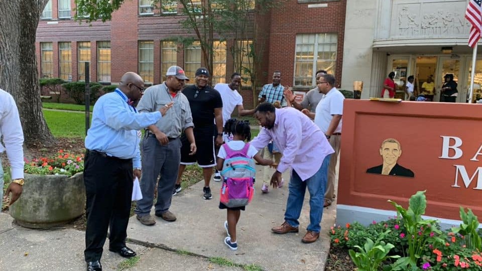 Black Dads Act As Cheerleaders For Students On Their First Day Back To School At Barack H. Obama Magnet Elementary School