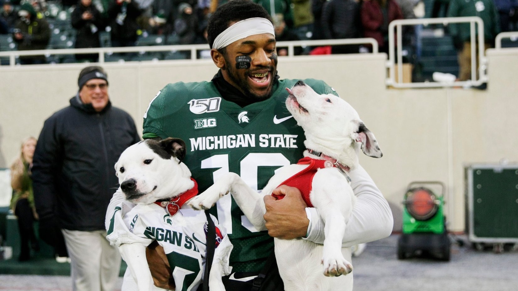 Michigan State Athlete Who Lost Both Of His Parents Has Dogs Escort Him During Senior Night In Touching Video