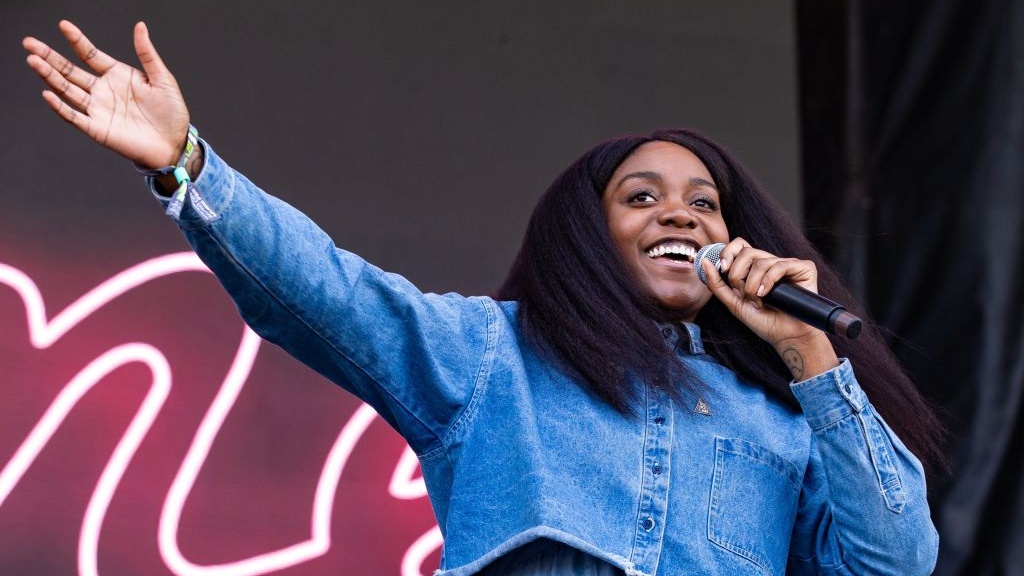 Noname Establishes National F**k Amazon Day, Encouraging Folks To Get A Library Card And, Obviously, Give A Middle Finger To Major Corporations