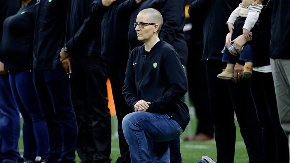 Minnesota's Teacher Of The Year Takes A Knee During The National Anthem At College Football Championship