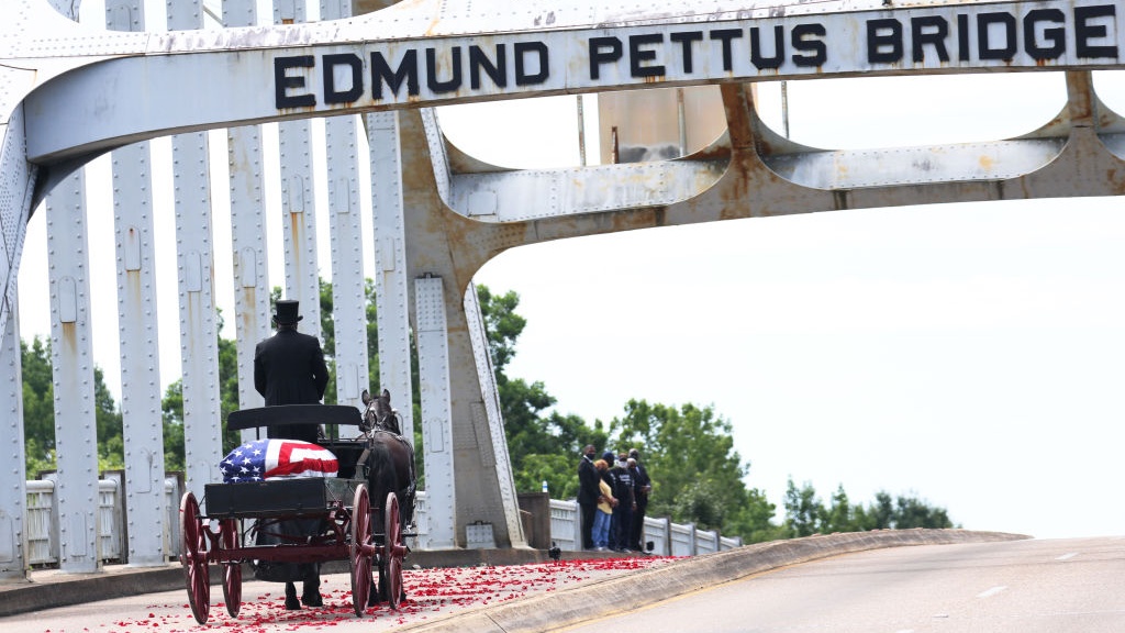 John Lewis Carried Across Selma's Edmund Pettus Bridge, Where He Marched On Bloody Sunday, During Memorial Procession