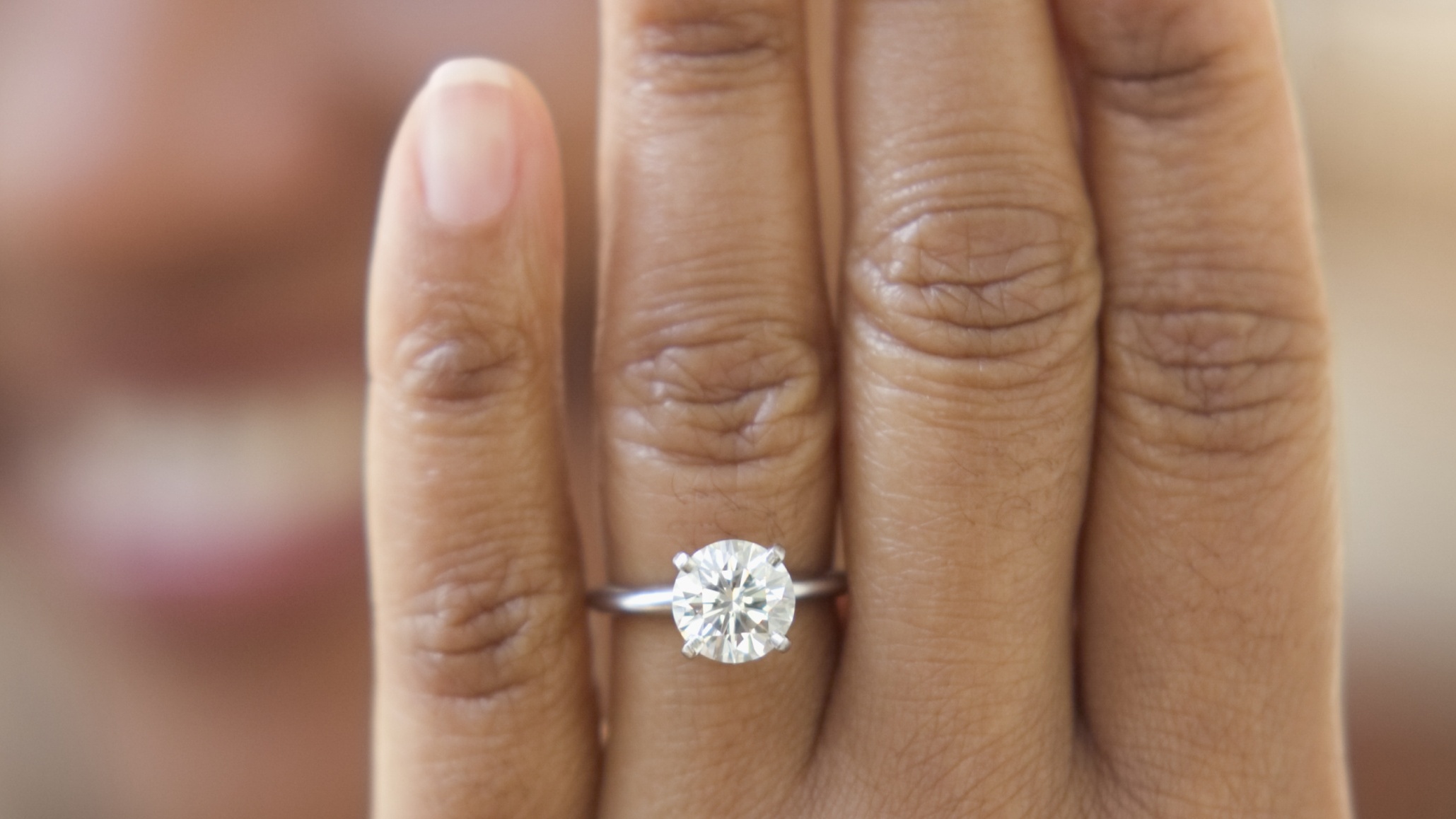 Couple's Marriage Proposal Goes Viral After Man Pops The Question With 5 Rings