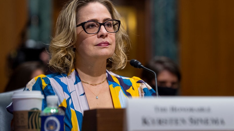 Sen. Kyrsten Sinema Wore A Denim Vest To The Capitol And We Can’t Stop Staring In ‘Now, You Know If That Was One Of Us’