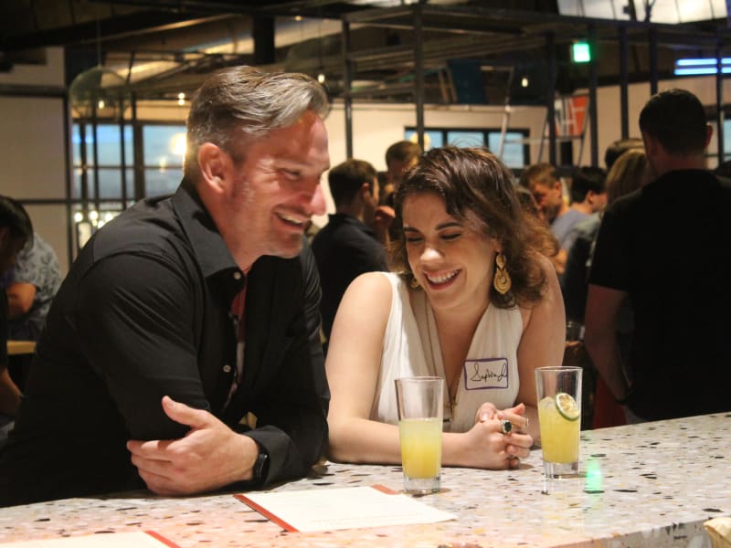 Two guests talking at a Mingle Singles event