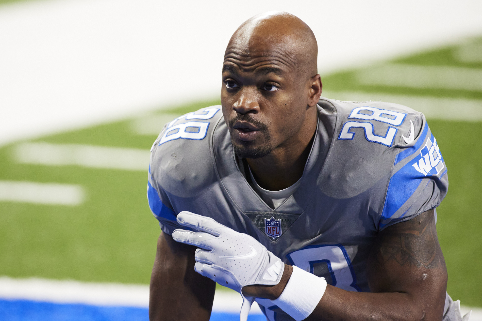 INGLEWOOD, CA - NOVEMBER 7: Tennessee Titans running back Adrian Peterson  #8 father Nelson Peterson holds up his son game worn jersey after the  Tennessee Titans game versus the Los Angeles Rams