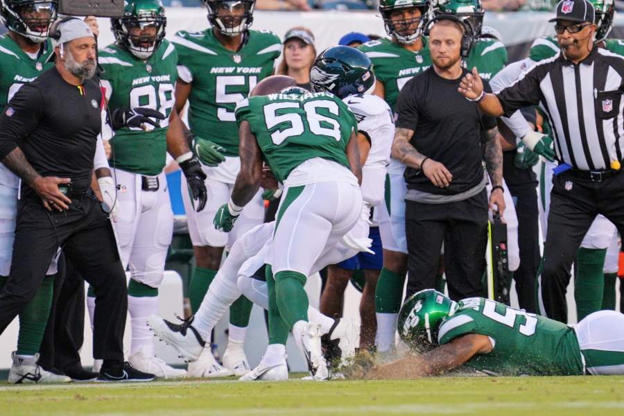 New York Jets linebacker Quincy Williams (56) reacts after breaking up a  pass in the end zone against the Buffalo Bills during the second quarter of  an NFL football game, Monday, Sept.