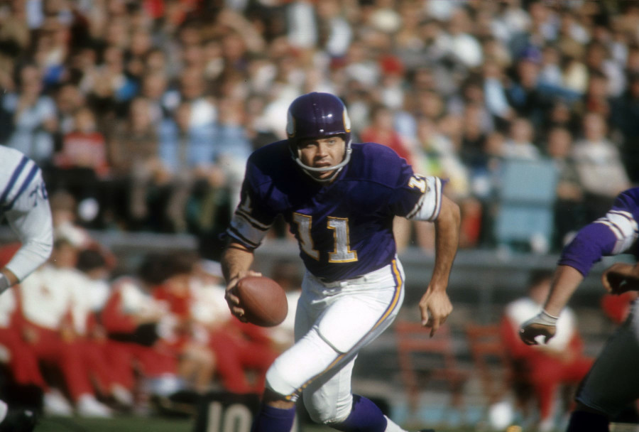 Minnesota Vikings quarterback Joe Kapp (11) raises left arm and readies the  ball with his right to get off a second-quarter pass in the NFL  Championship Game in Minneapolis, on Jan. 4