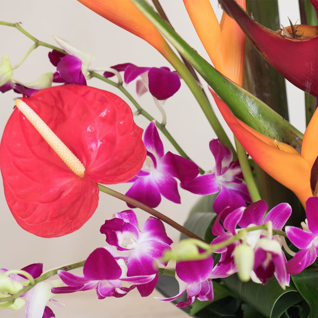 This stylish tall piece featuring colorful exotic flowers is the perfect gift