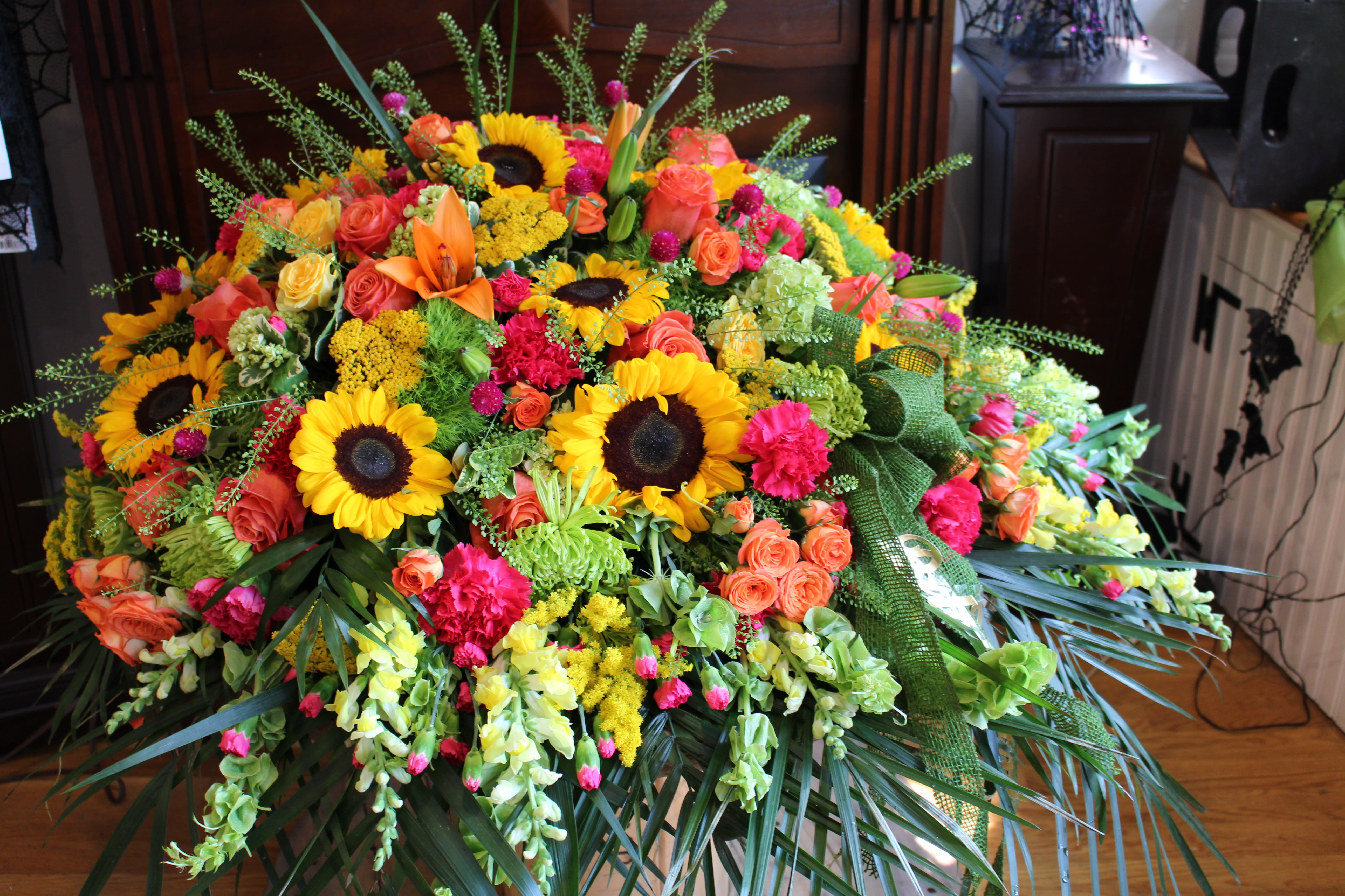 sunflower casket cover in Stoneham, MA Evergreen Florist Inc.