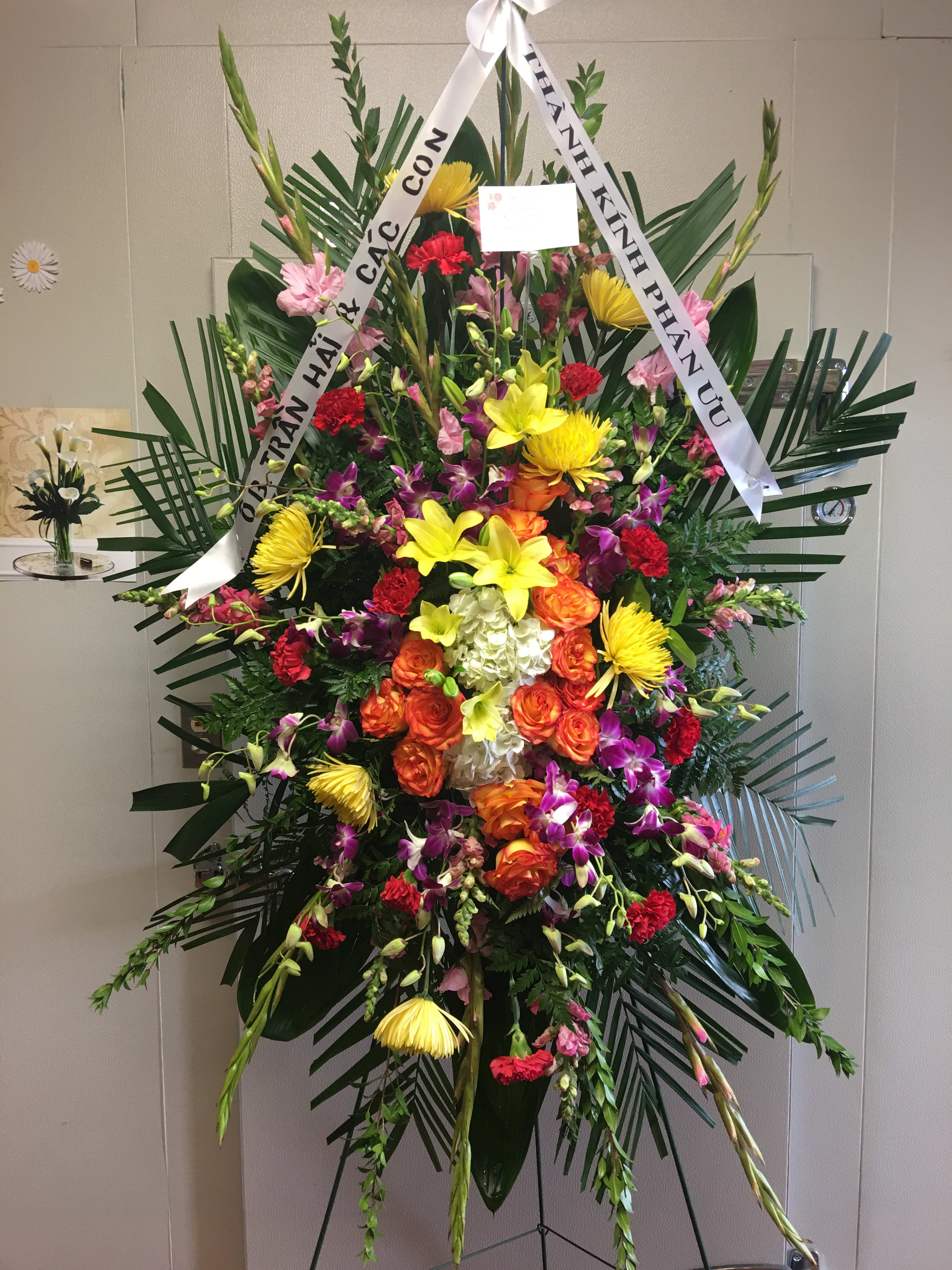 Mixed colors funeral spray in San Diego, CA | Liz's Flowers