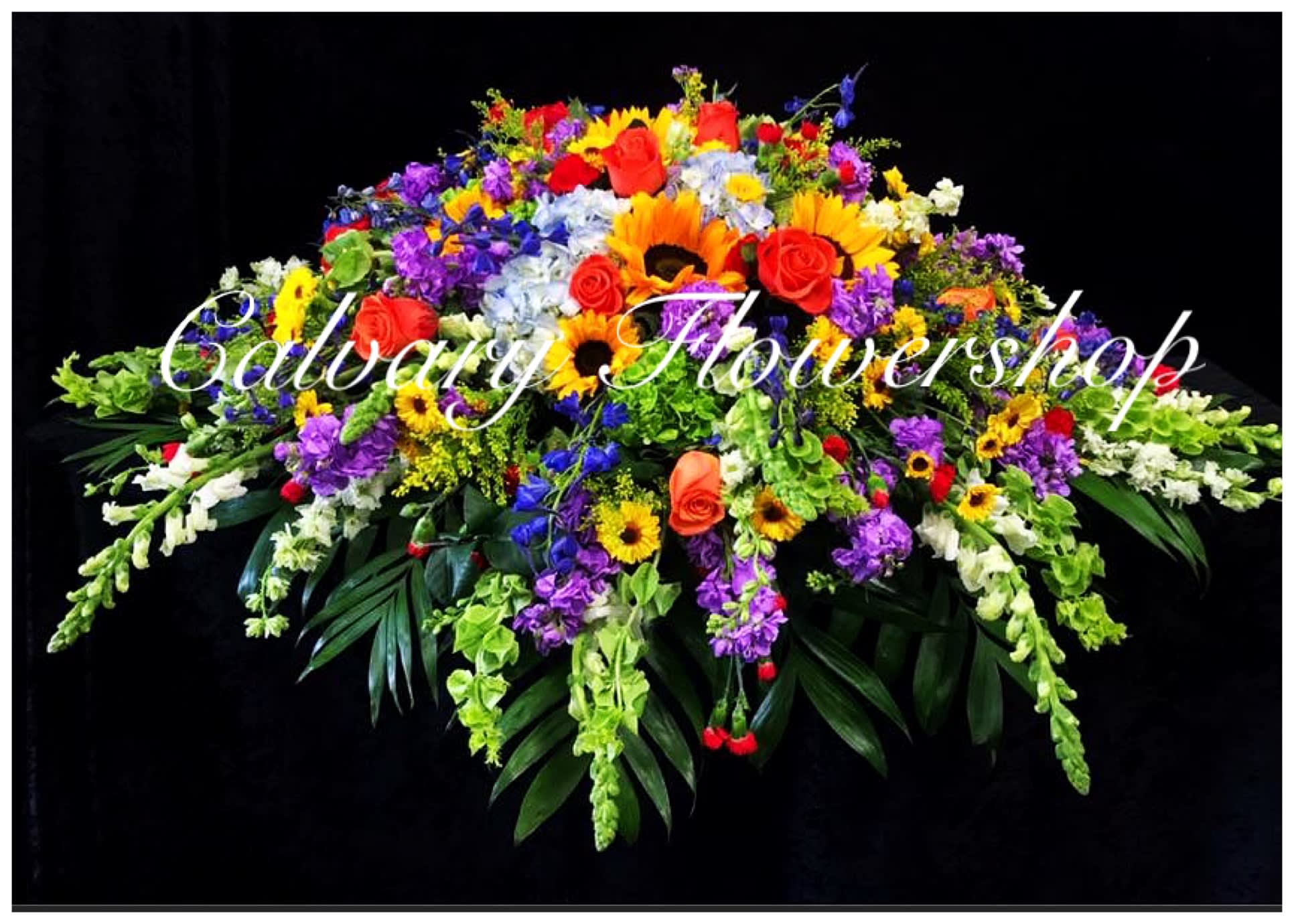 Sympathy of Colors Casket Spray in Los Angeles CA Calvary Flower Shop