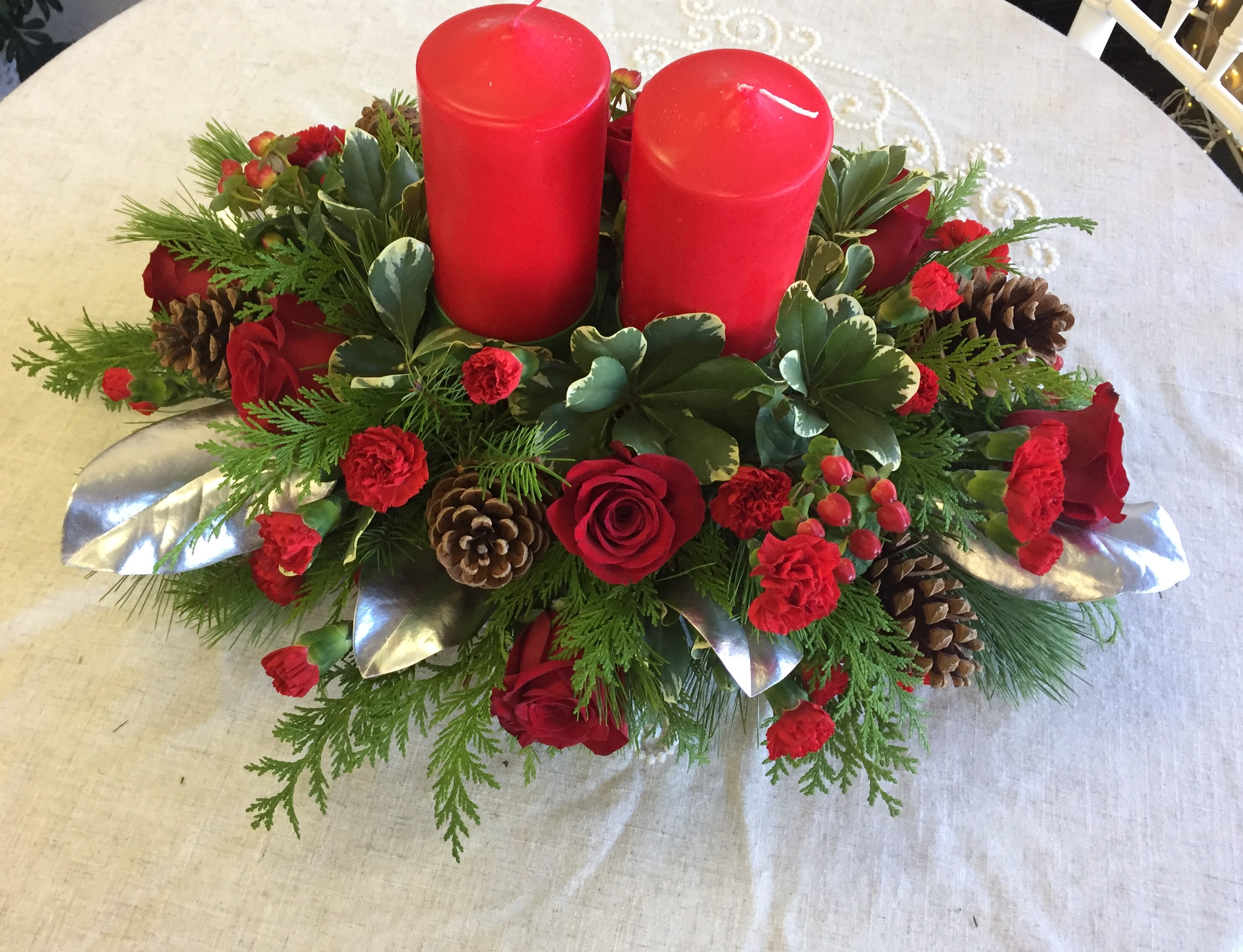 Christmas Centerpiece With Red Pillar Candles In San Juan