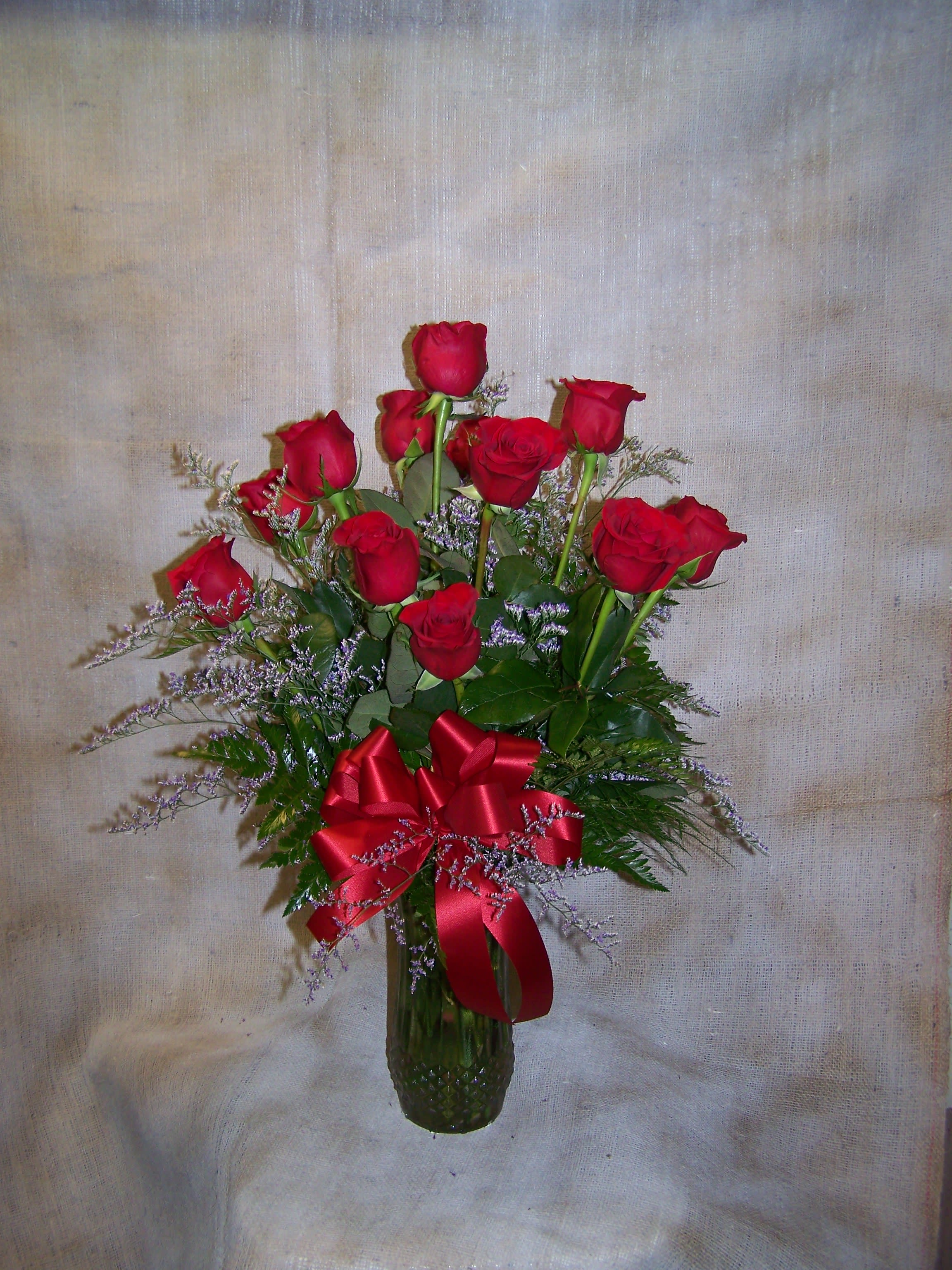 dozen red roses arranged