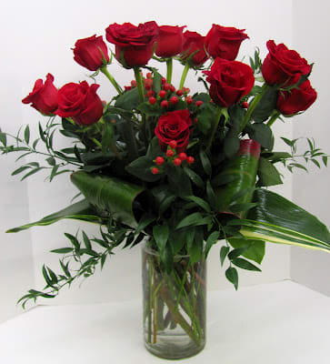 dozen roses arranged with