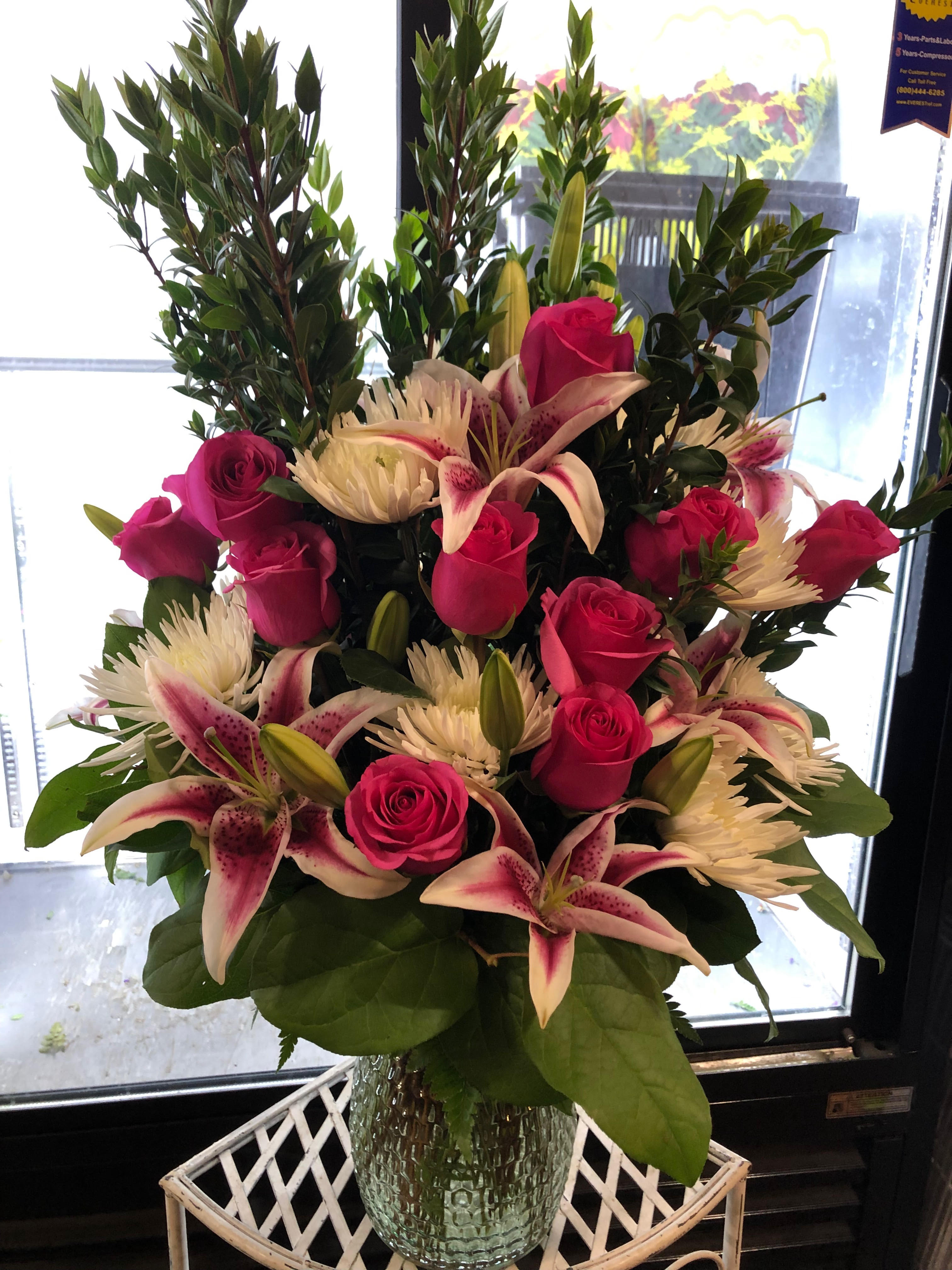 Delux Lilly Rose Floral Arrangement By Logan Floral Designs And
