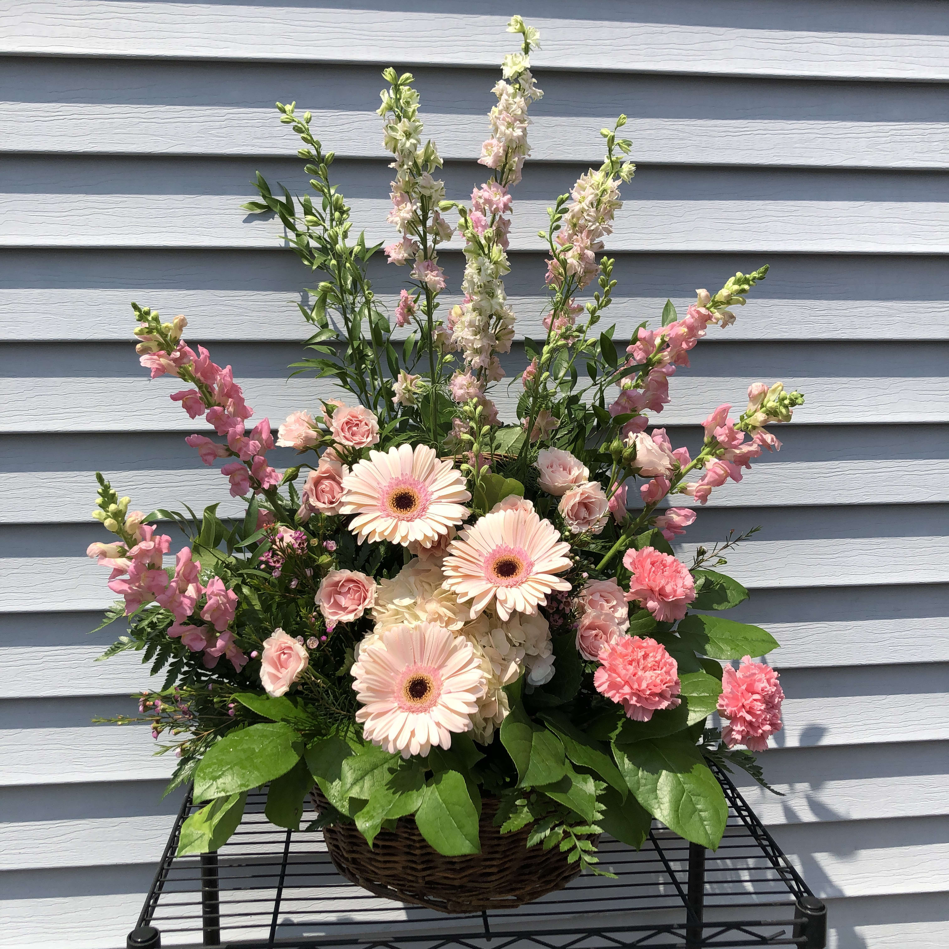 Evans Blush Wicker Funeral Basket in Peabody, MA Evans Flowers