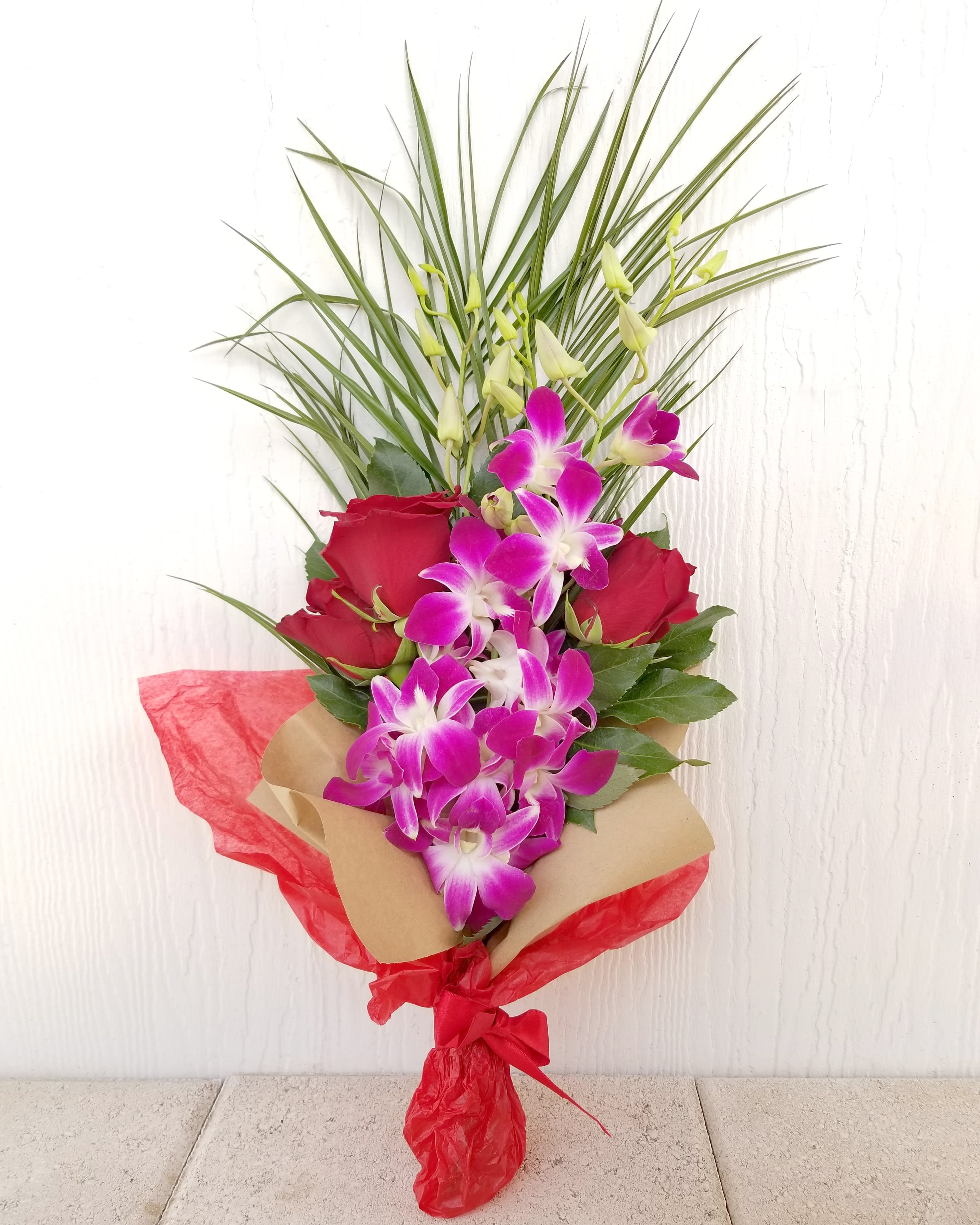Red Roses & Orchids wrapped bouquet in Scottsdale, AZ Paradise Valley