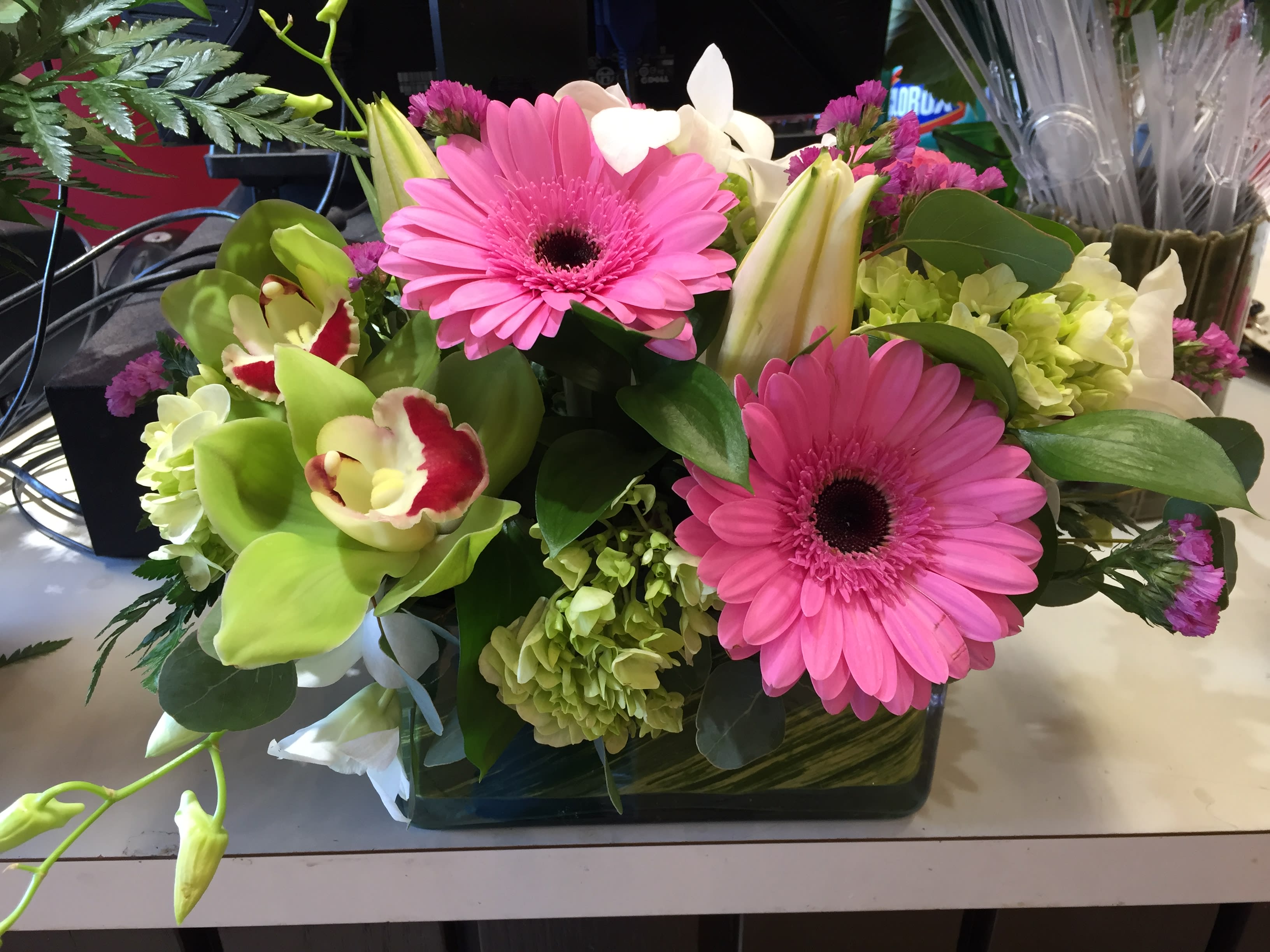Colorful arrangement in a wooden box in Medway, MA Luna's Flower Shop