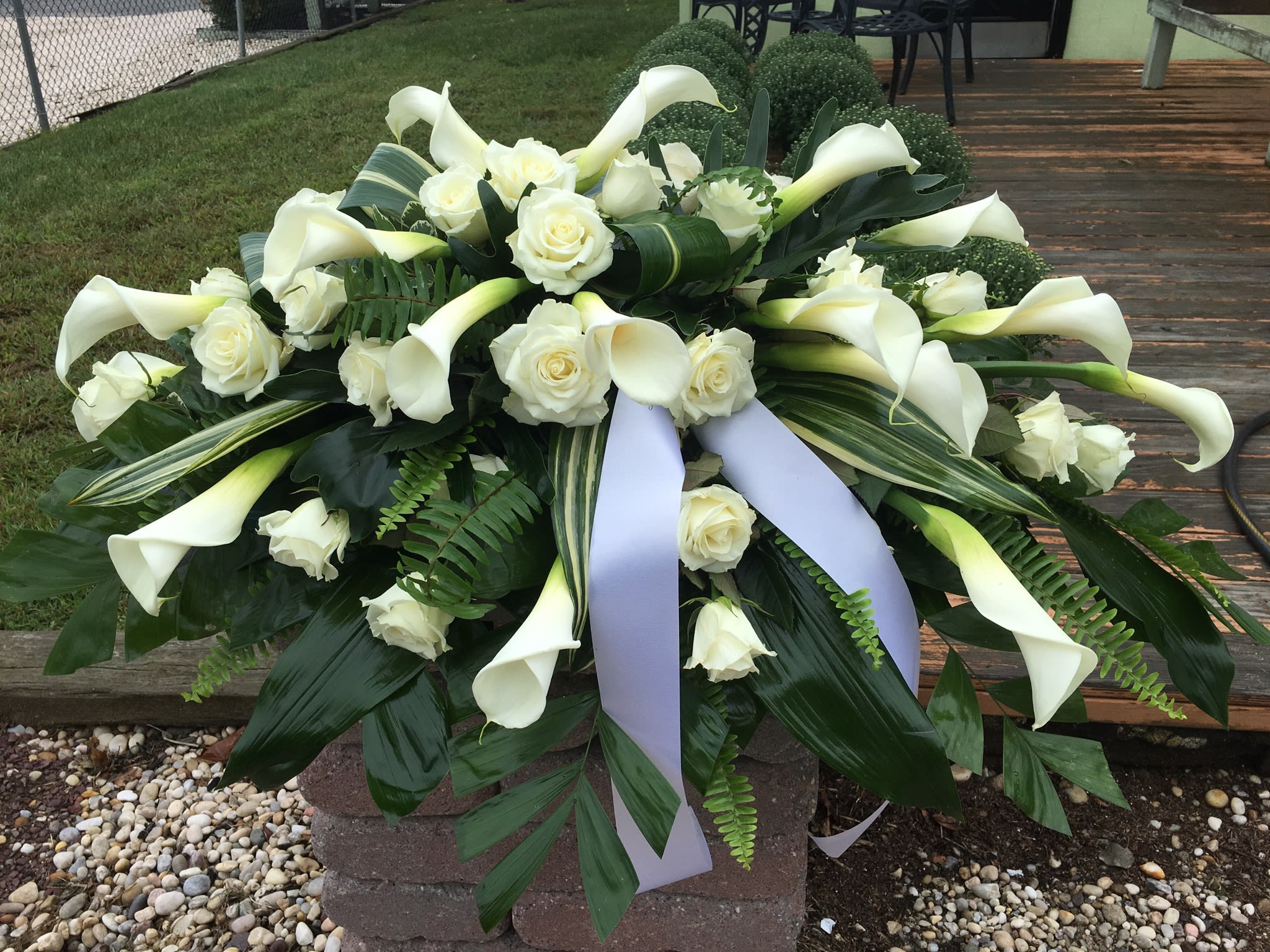 Calla lilies and white roses casket spray in Patchogue, NY Tall Tree
