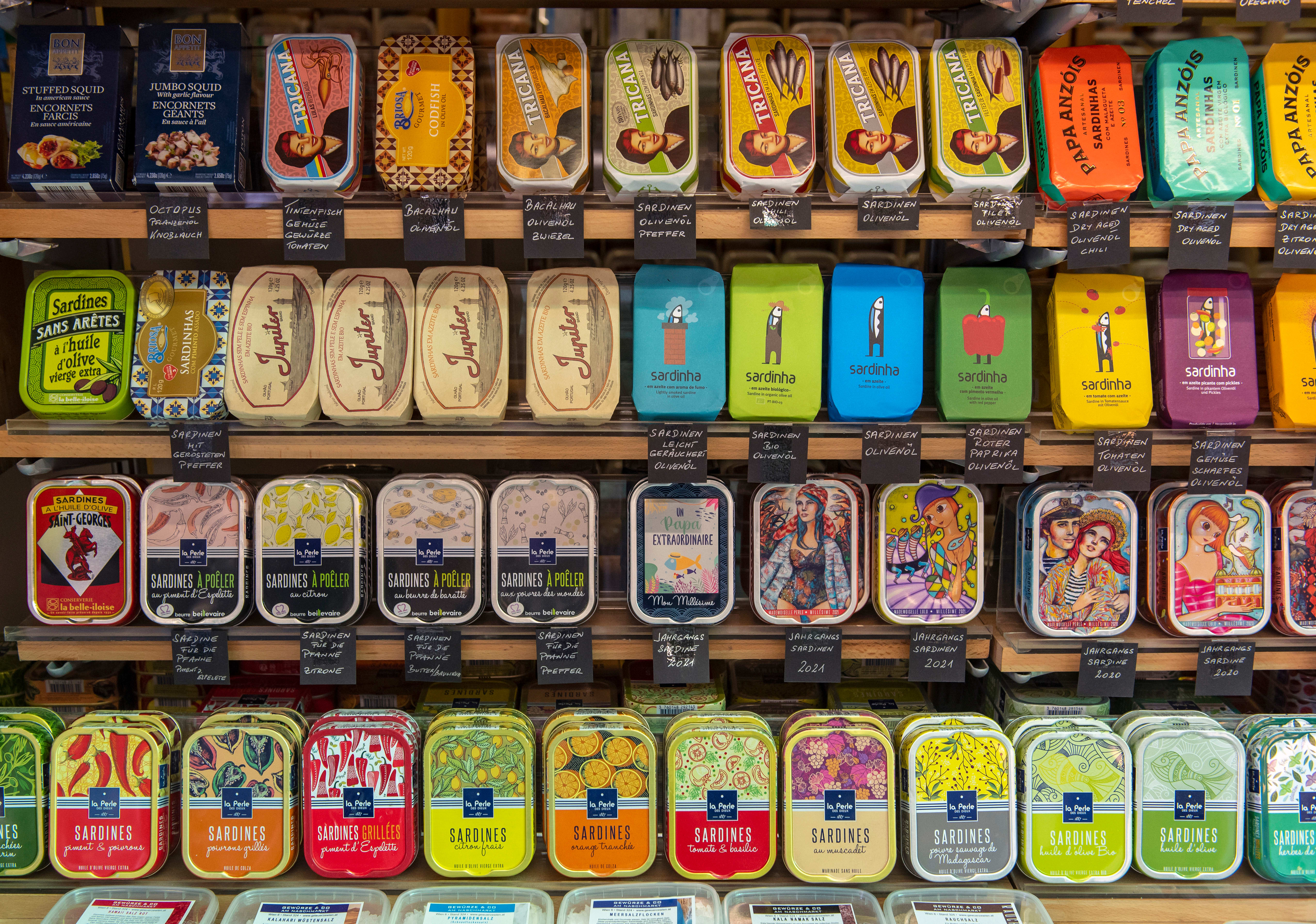 Shop window with a colourful arrangement of sardine cans, Vienna, Austria.