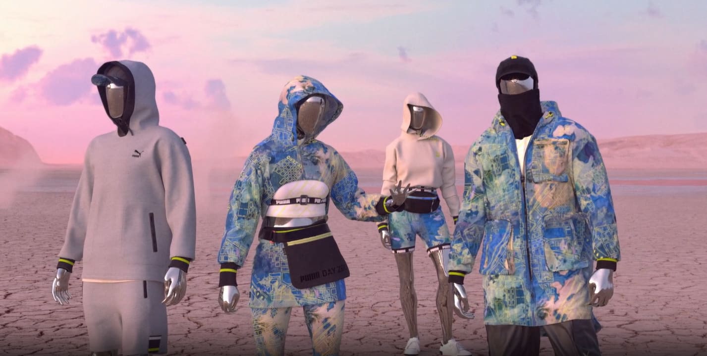 Four mannequins wearing futuristic outdoor apparel