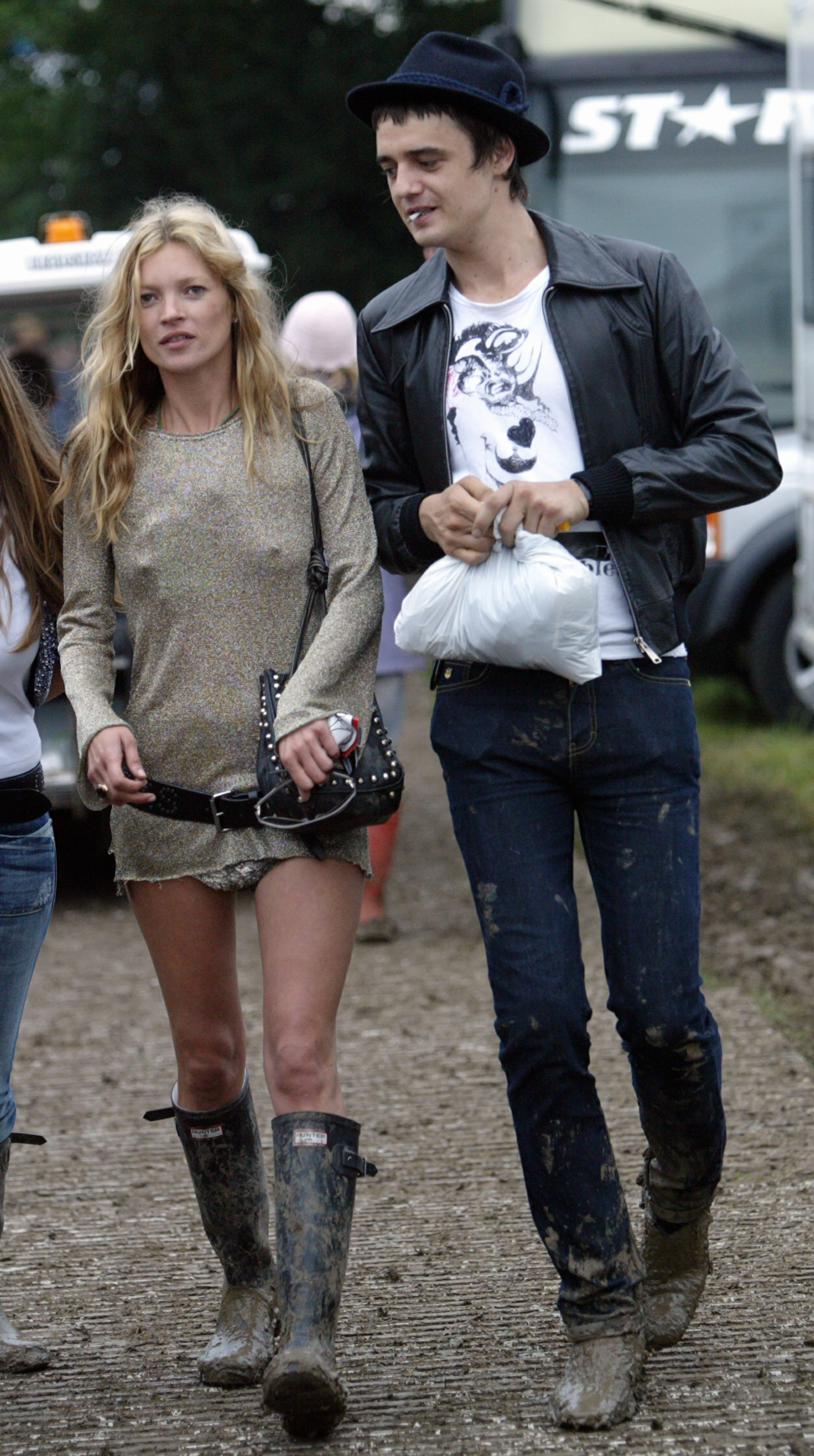 Model Kate Moss and singer Pete Doherty walking at the backstage