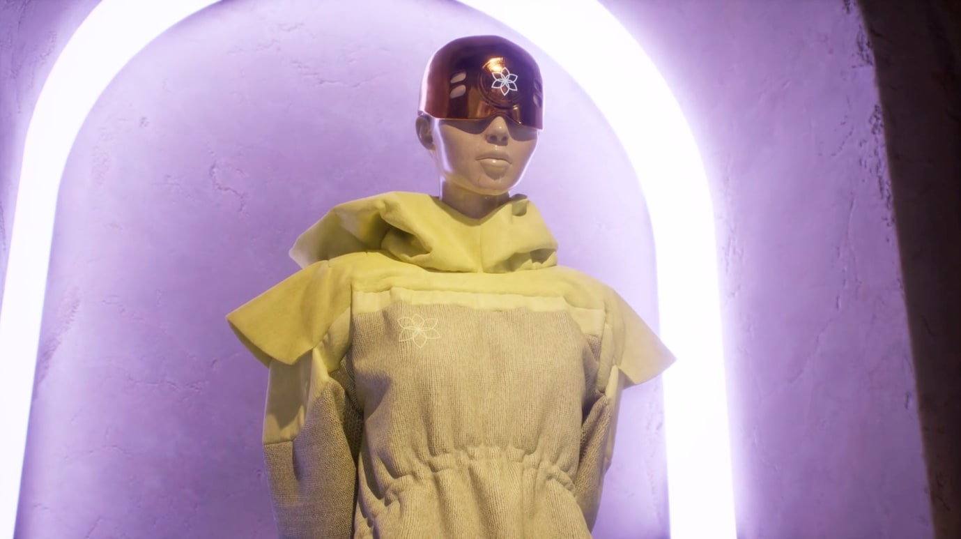 Futuristic mannequin wearing visor and textured robe under glowing arch