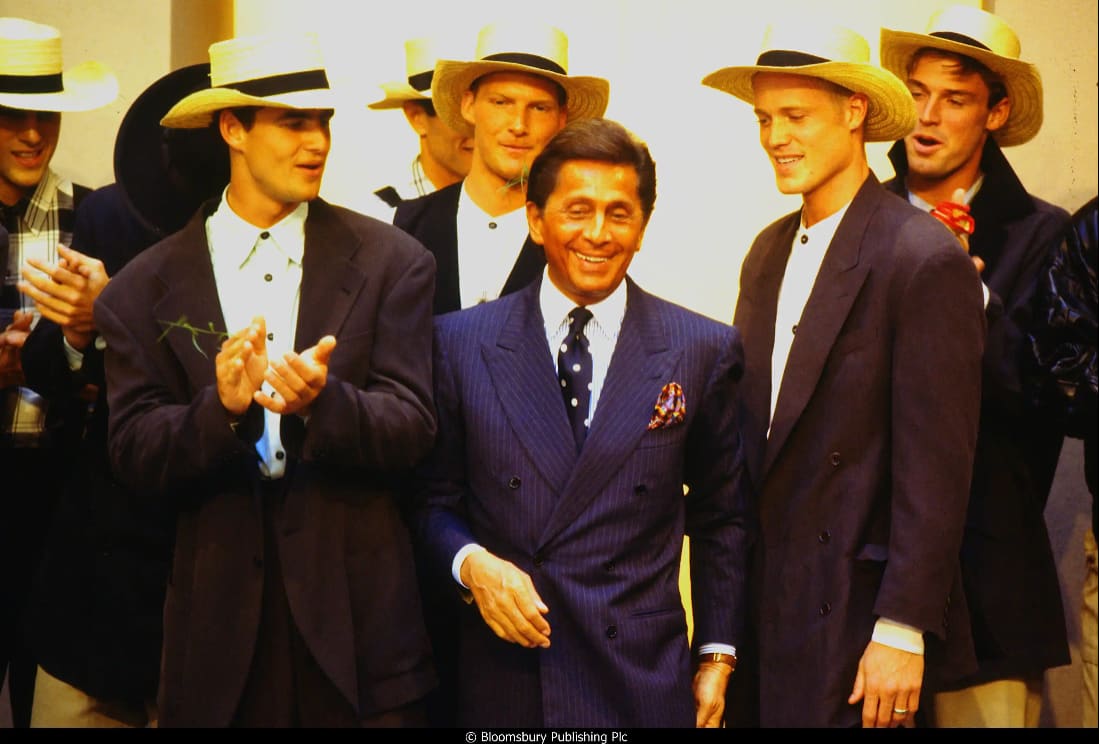 Valentino Garavani surrounded by models