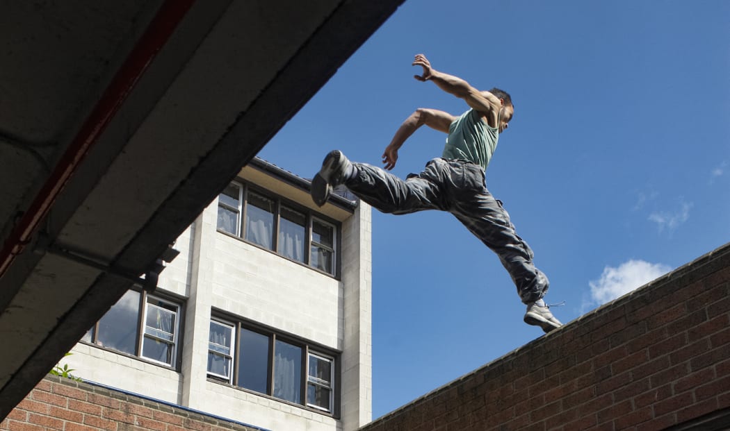 Man jumping Large gap between buildings