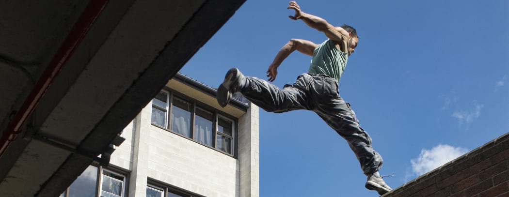 Man jumping Large gap between buildings