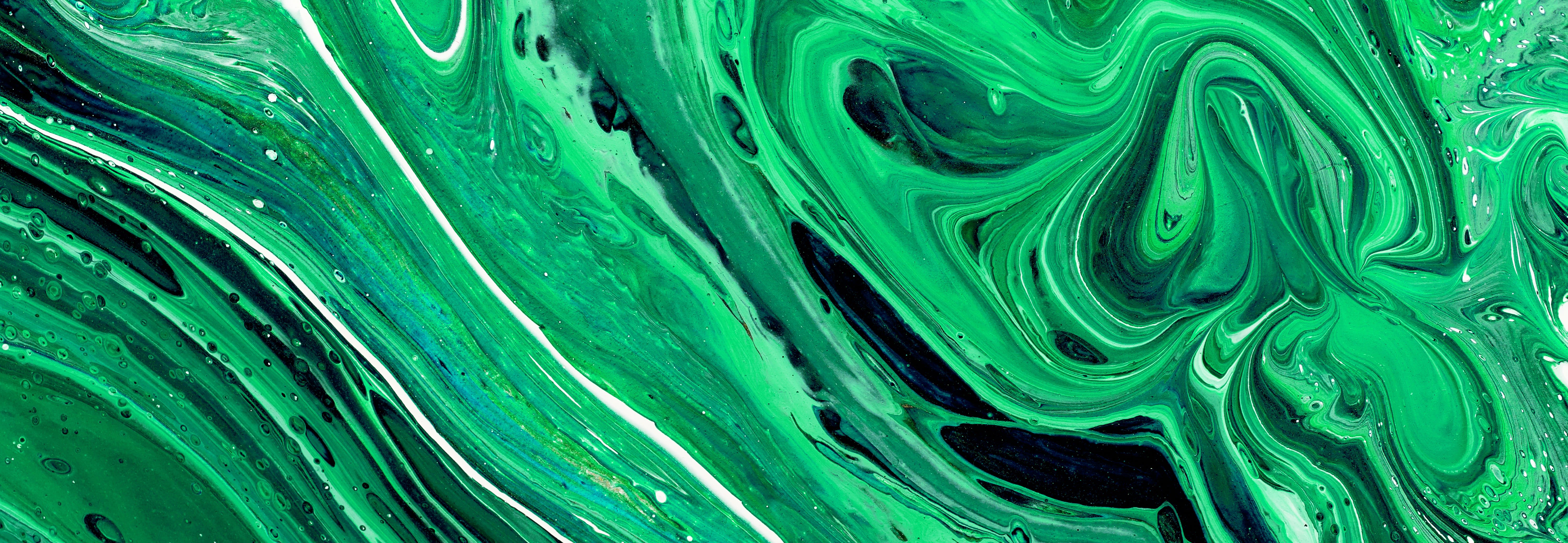 Abstract colourful background texture fluid art acrylic paints. Green colour - stock photo Credit: 	Photo by Alex Tihonov via Getty Images
