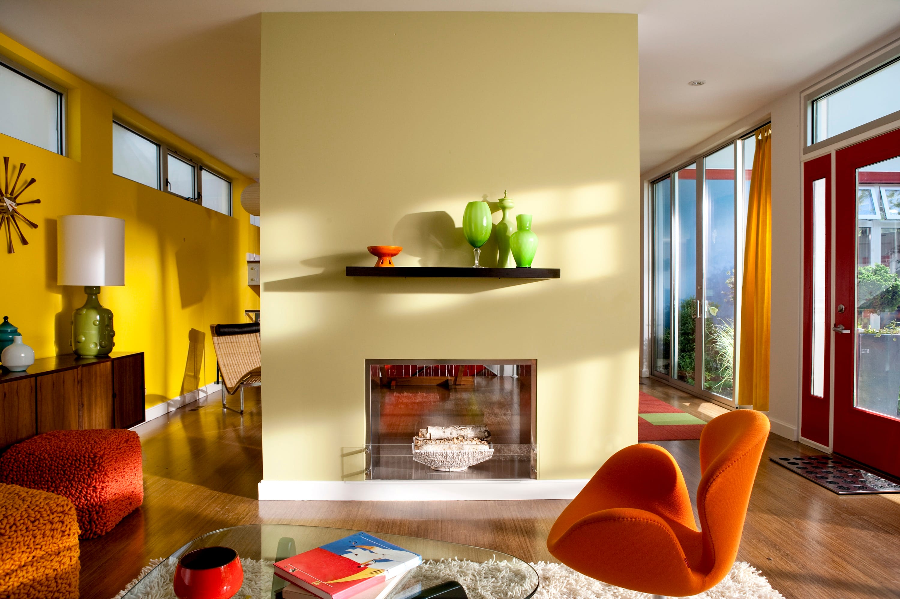 Bright modern living room with bold yellow and orange accents