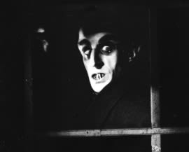 Count Orlok looks in through a window in a still from the 1922 expressionist horror film 'Nosferatu: A Symphony of Horror', directed by F. W. Murnaul