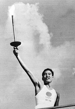 Olympic torch runner Yoshinori Sakai at the Tokyo 1964 opening ceremony