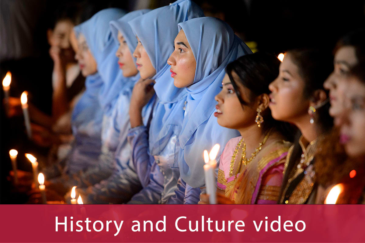 Young Asian women holding candles