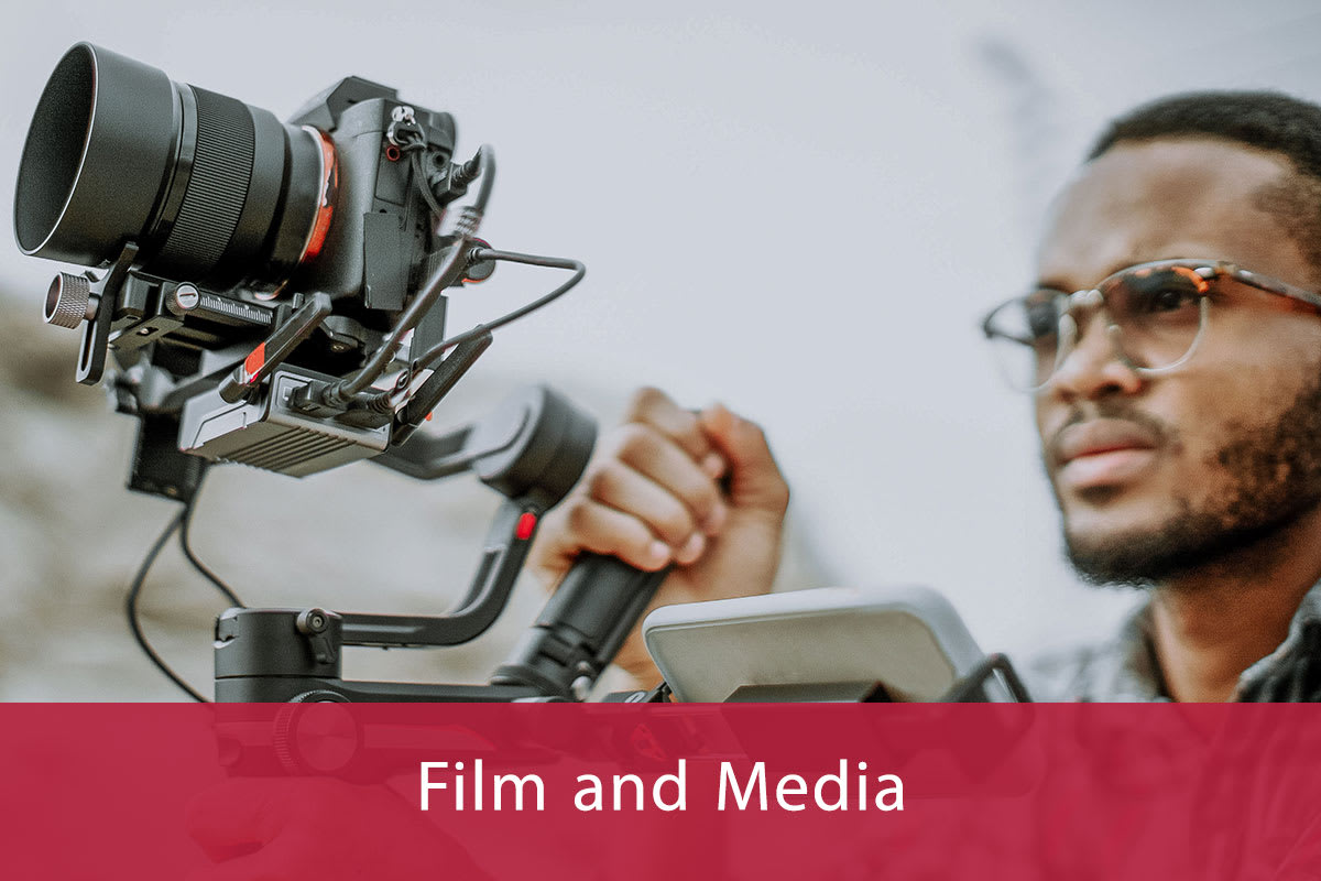 Young Man Operating Video Camera
