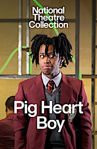 An actor stands facing the camera wearing a school uniform in a production of Pig Heart Boy, recorded for the National Theatre