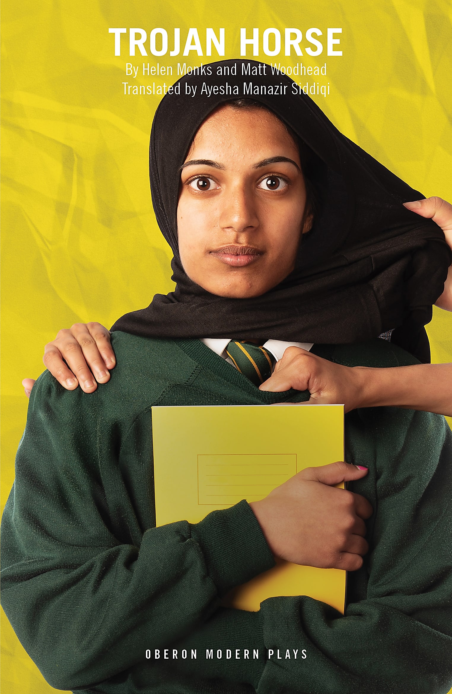 A Muslim schoolgirl has her hijab grabbed by a hand off screen on the front cover of Trojan Horse by Matt Woodhead and Helen Monks, translated by Ayesha Manazir Siddiqi