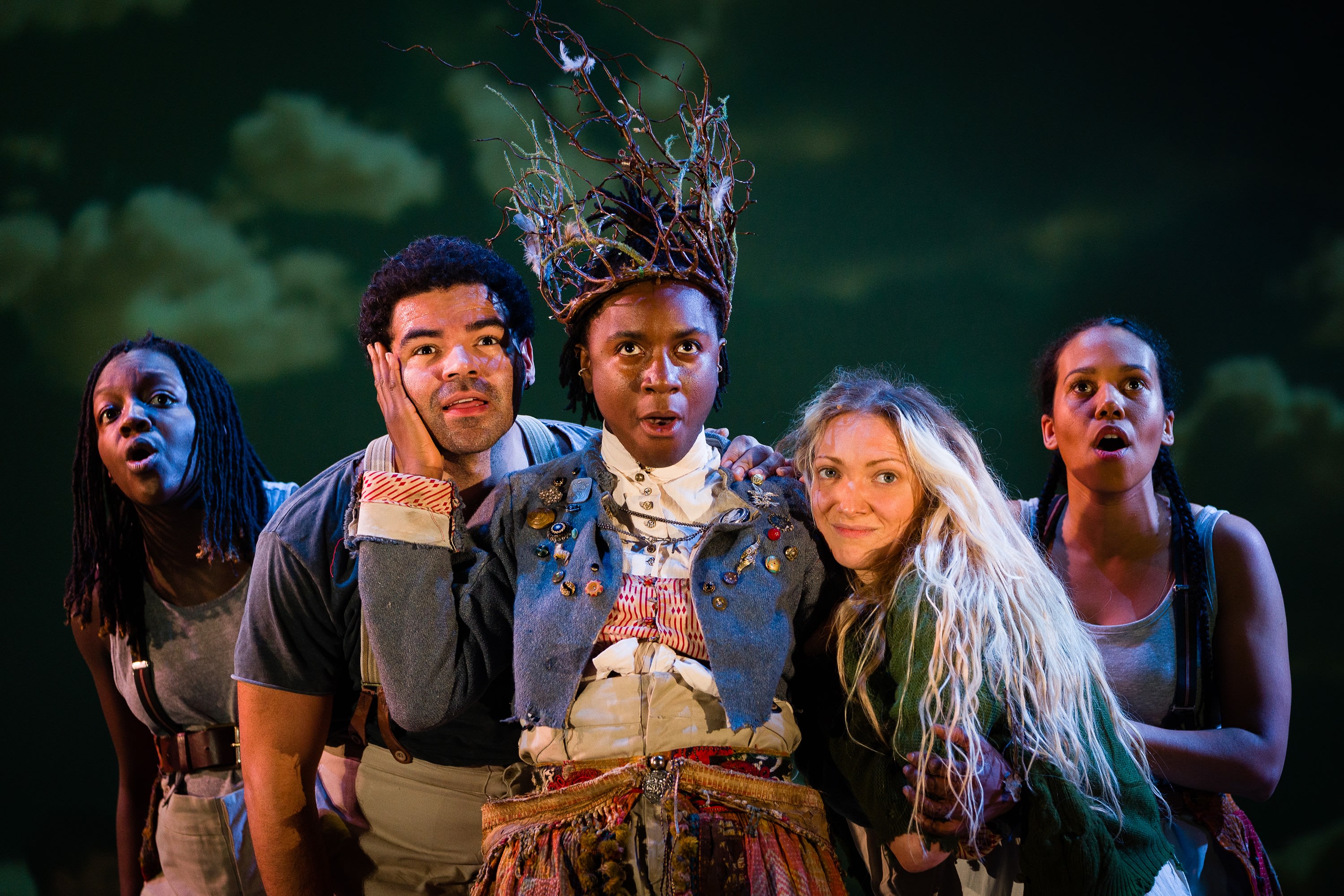 5 actors looking up with wonder in the production of Wuthering Heights, directed by Emma Rice