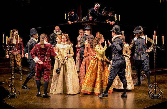 An ensemble of actors sat on stage performing Romeo and Juliet at the Stratford Festival in Stratford, Ontario, Canada