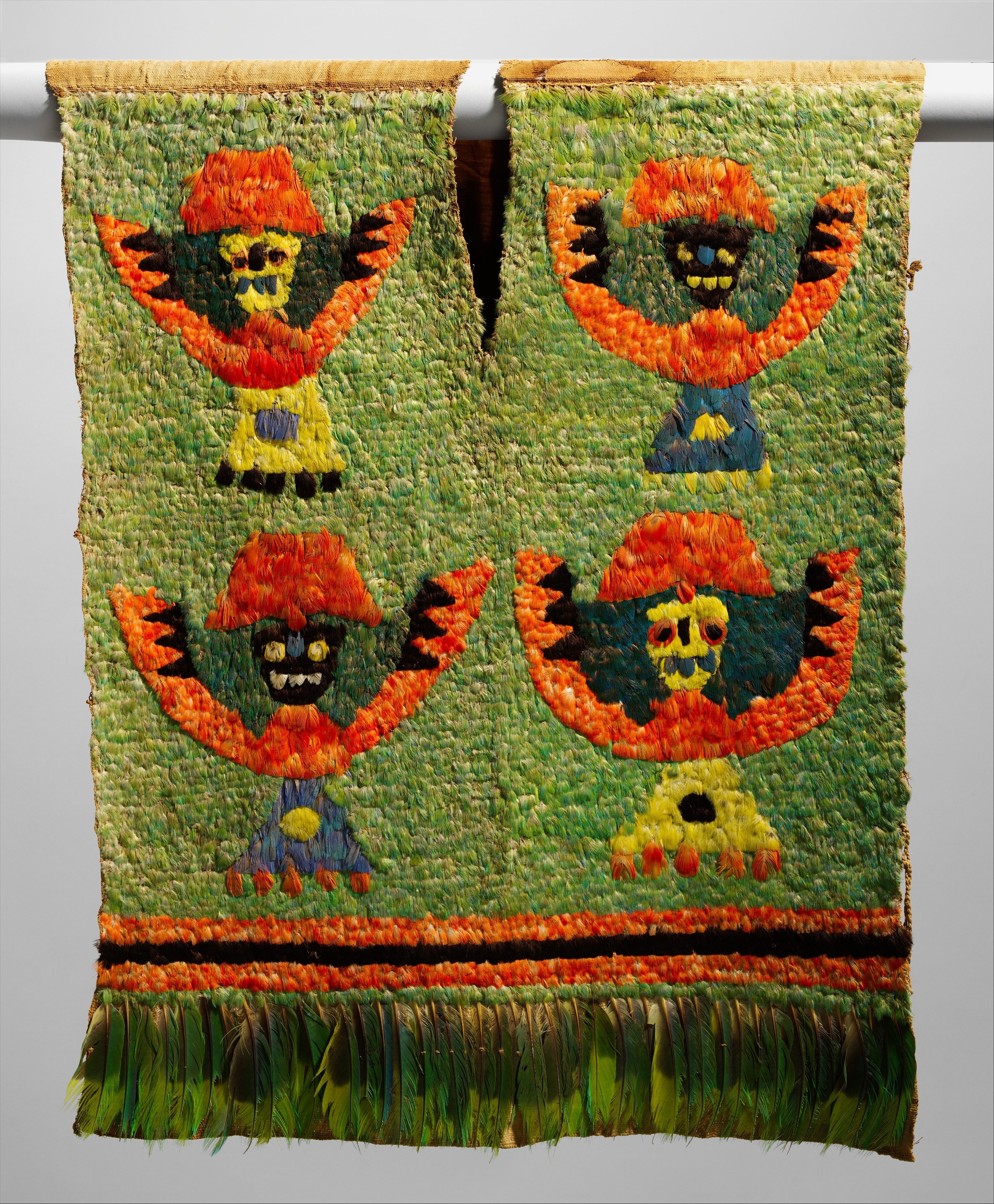 This image shows a Feathered Tabard (The Metropolitan Museum of Art).